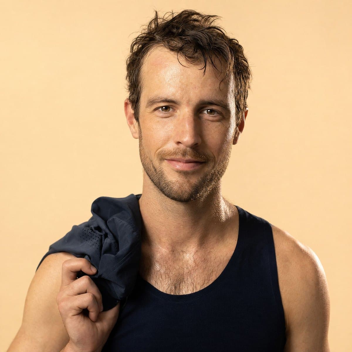 A run club runner after a session, relaxed smile